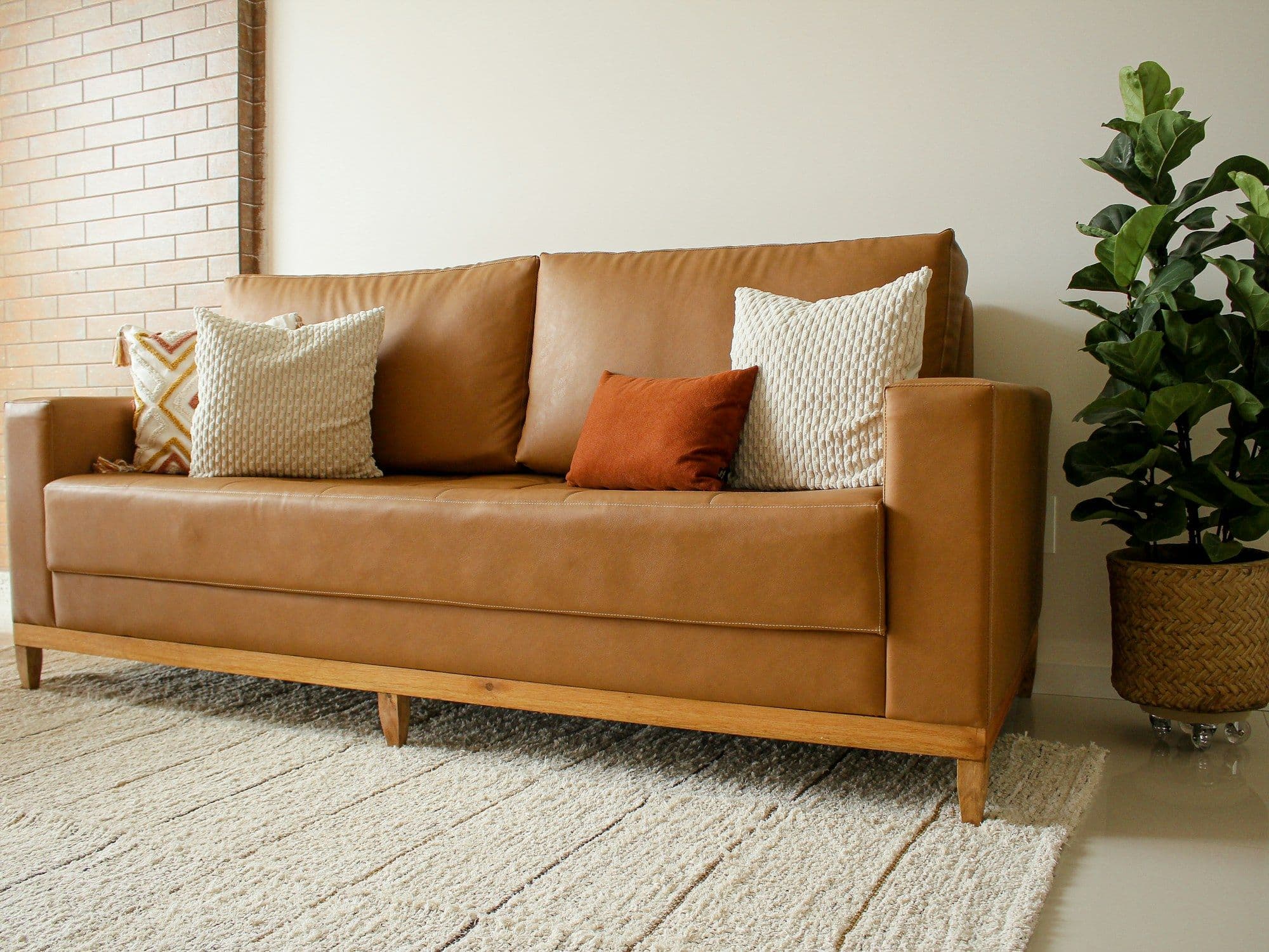 Leather sofa and wood furniture that benefit from conditioning care