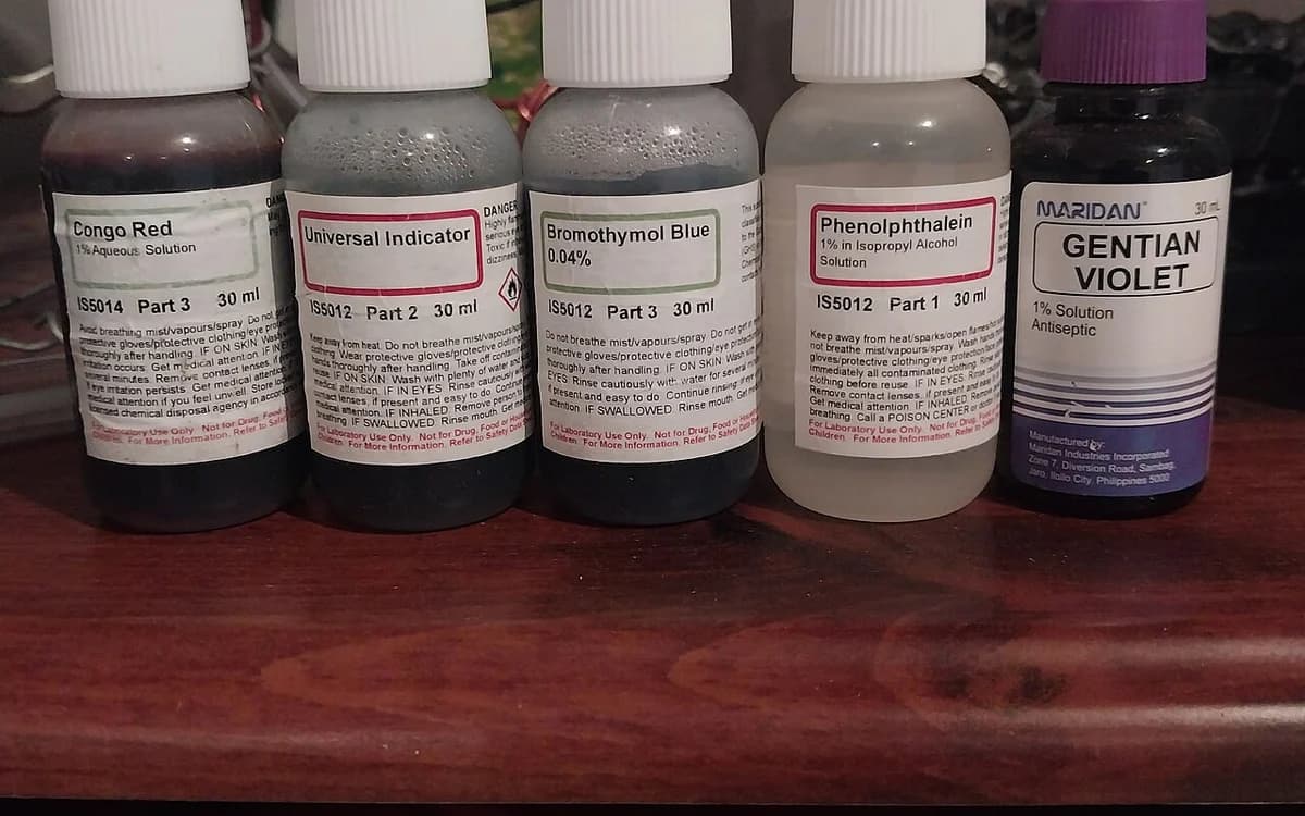 Laboratory pH indicator vials verifying neutral pH 6.5 to 7.5 cleaning formulation