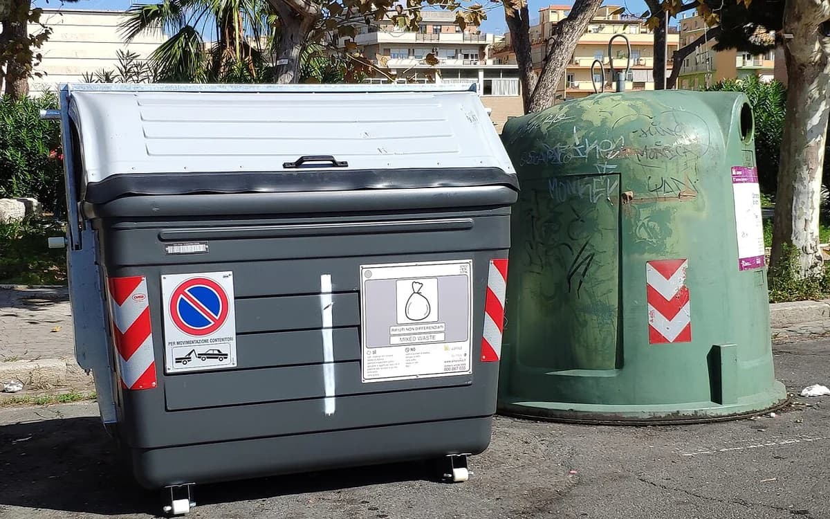 Commercial waste and recycling containers staged in a building collection zone