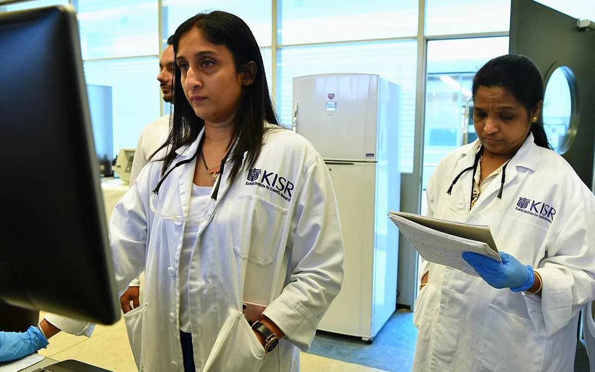 Analytical chemist reviewing laboratory chromatography and spectrophotometry test reports