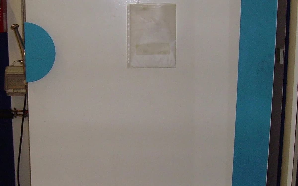 Controlled stainless-steel environmental test chamber in an analytical laboratory