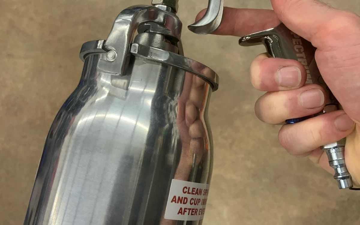 Precision HVLP gravity-feed spray gun with stainless steel fluid nozzle for nano-coating atomization