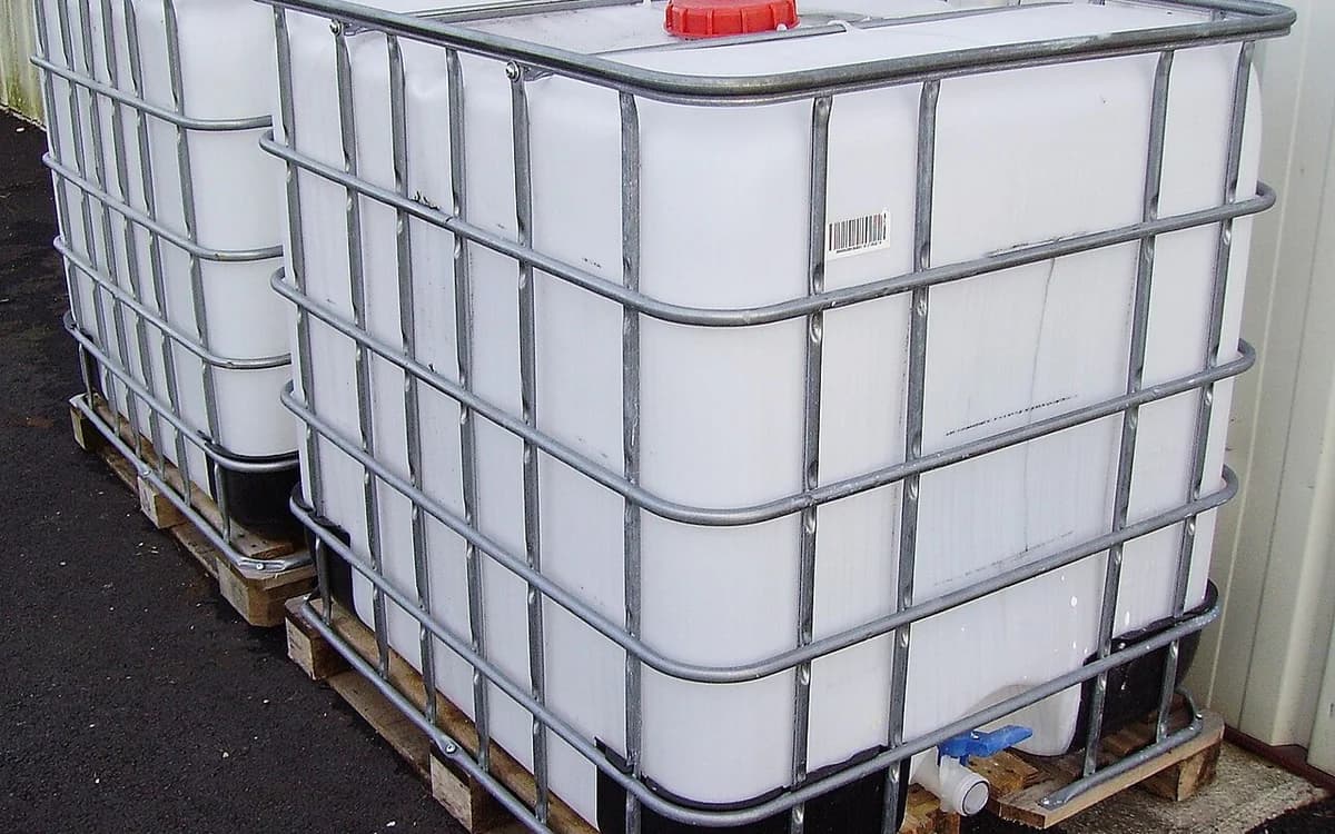 1000L intermediate bulk containers (IBC totes) in galvanized steel cages on export pallets