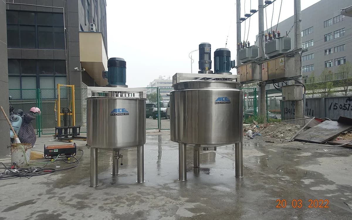 Industrial stainless-steel liquid mixing tank vessel with top agitator motor