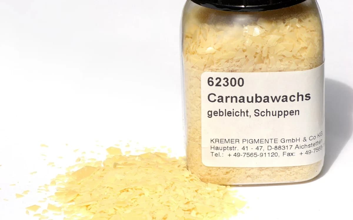 Refined natural carnauba palm wax flakes used in low-moisture furniture barrier emulsions