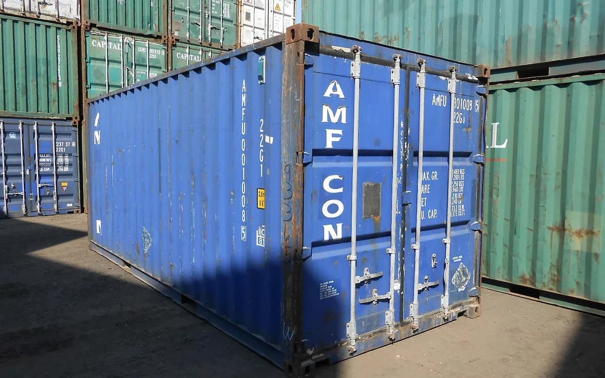 Stacked 20-foot and 40-foot intermodal steel shipping containers in an export port storage yard