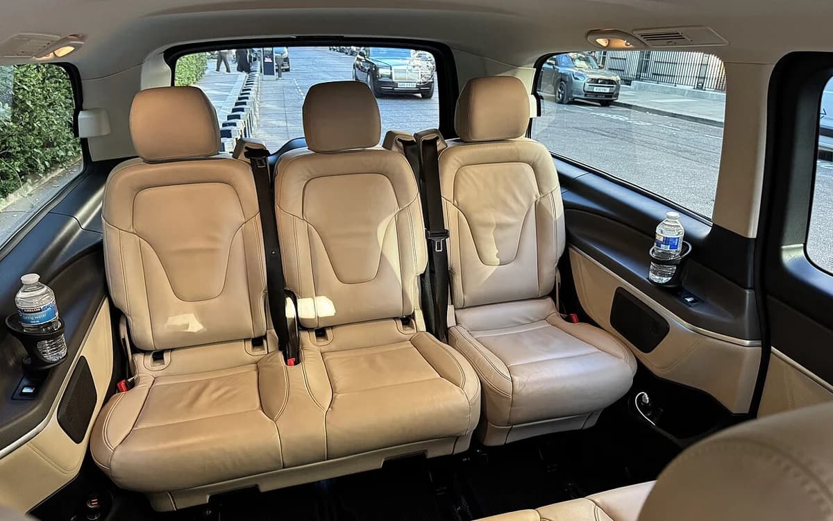 Luxury automotive leather seat upholstery and woodgrain door trim