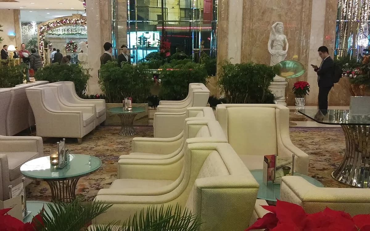 Hotel lobby lounge furnished with white leather sofas and armchairs