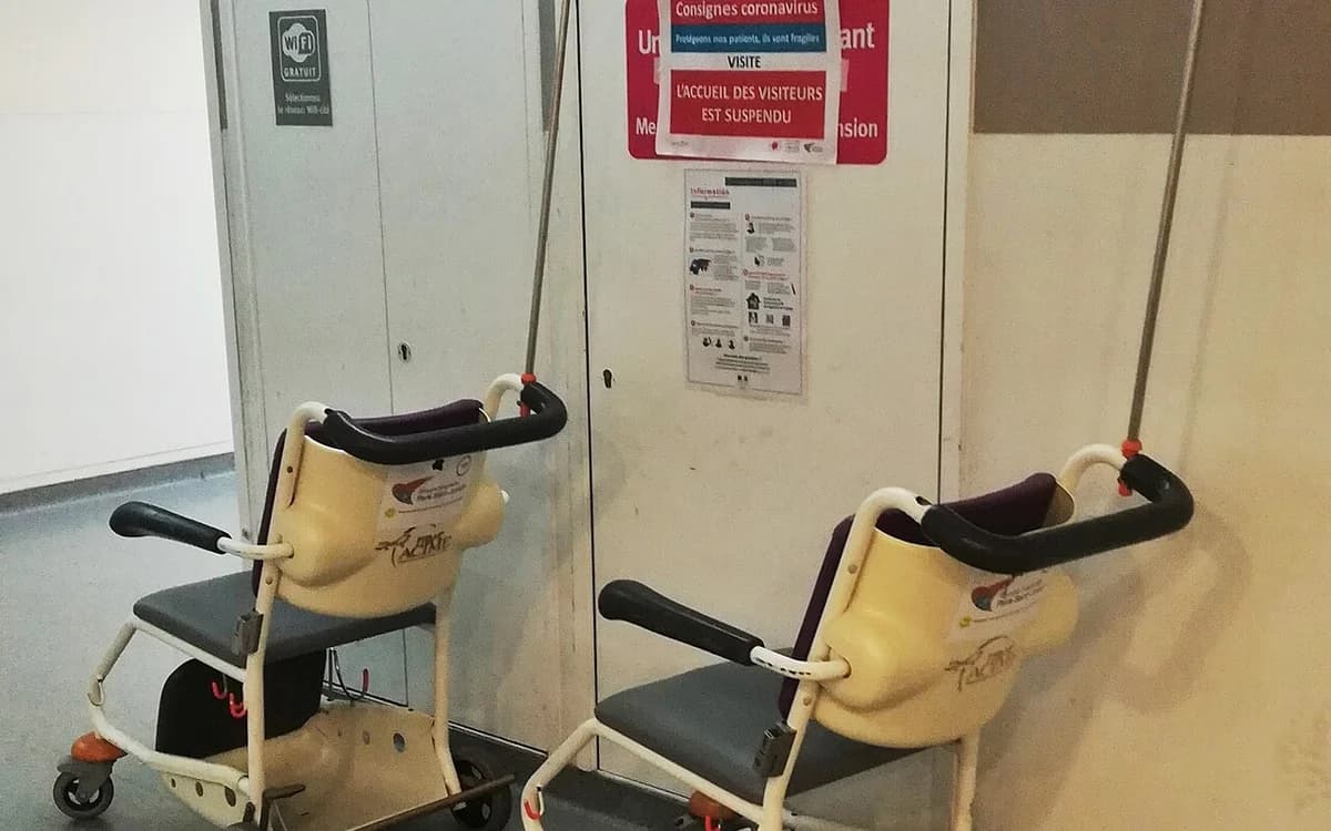 Wheelchairs lined along a clean hospital and rehabilitation center corridor