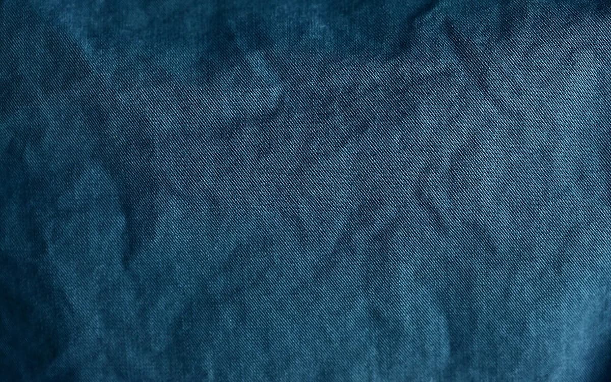 Macro view of woven blue cotton textile fibers